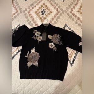 Nicole Miller Black Sweater with Sequin Floral Accents. Size Medium. NWT.